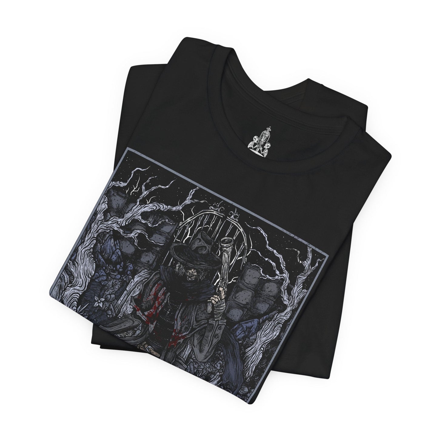 Folded T-shirt featuring Father Gascoigne from Bloodborne, the tragic hunter-priest known for his brutal combat style and swift descent into beastdom. Clad in tattered clergy robes and wielding his hunter’s axe alongside a blunderbuss, Gascoigne represents the blurred line between man and monster. This design captures the eerie moment before his transformation, showcasing the resolve and sorrow of a hunter doomed by the very hunt he embraced.