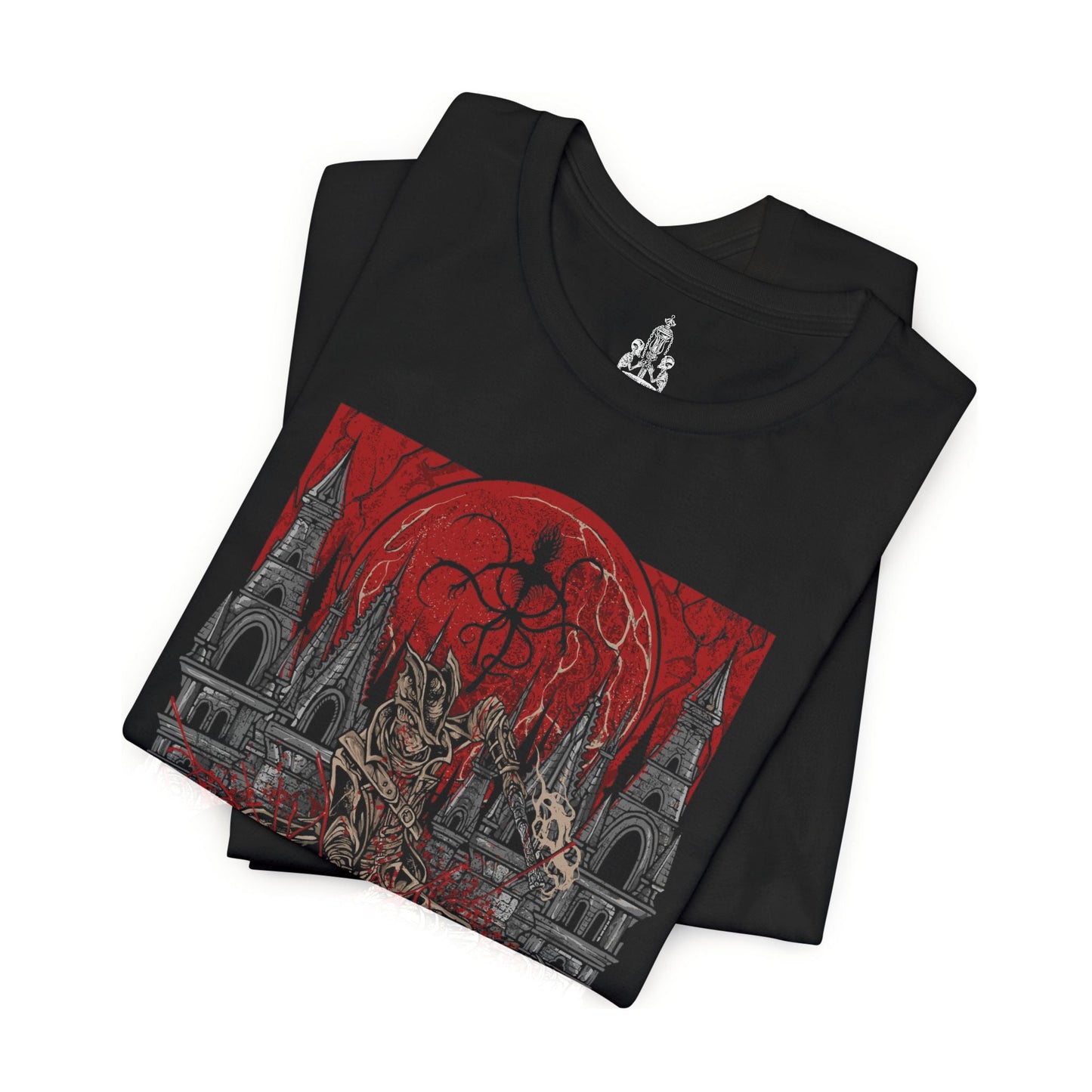 Folded T-shirt featuring a Hunter of Yharnam from Bloodborne, poised beneath a blood moon on the Night of the Hunt. Cloaked in gothic attire and armed with a trick weapon, the Hunter stalks the streets of Yharnam, battling beasts and madness alike. This design captures the eerie, violent elegance of the hunt’s grim ritual.