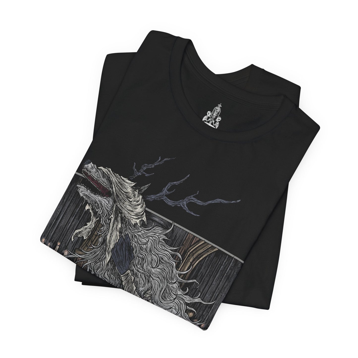 Folded T-shirt featuring Vicar Amelia from Bloodborne, the once-devout leader of the Healing Church transformed into a towering beast of fur and sinew. Clutching a sacred pendant in her grotesque paws, Amelia symbolizes the church’s descent into corruption. This design captures her dramatic shift from cleric to monster, framed in gothic horror and divine tragedy under the pale moonlight.