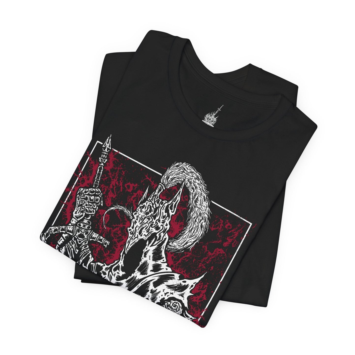 Folded T-shirt featuring Artorias the Abysswalker from Dark Souls, the legendary knight who sacrificed everything to halt the spread of the Abyss. Clad in tattered armor and wielding his massive greatsword with a shattered arm, Artorias stands as a symbol of heroic defiance and tragic downfall. This design captures the moment he’s overtaken by darkness, honoring his doomed fight to protect Oolacile and his undying will.