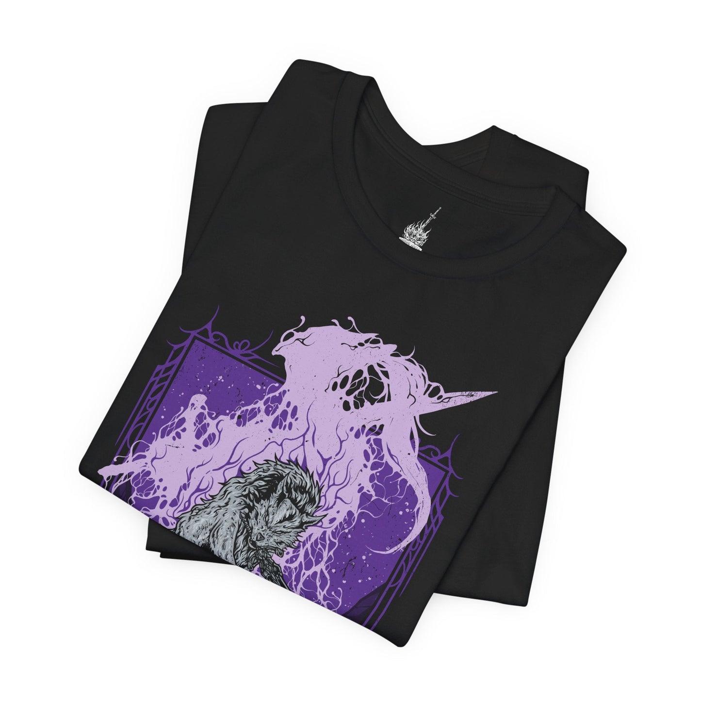 Folded T-shirt featuring Great Gray Wolf Sif from Dark Souls, the loyal companion of Artorias the Abysswalker. Wielding the Greatsword of her fallen master, Sif guards his grave deep within the dark forest, defending his honor with unwavering devotion. This design captures her tragic beauty and noble spirit—a symbol of loyalty, courage, and sorrow.