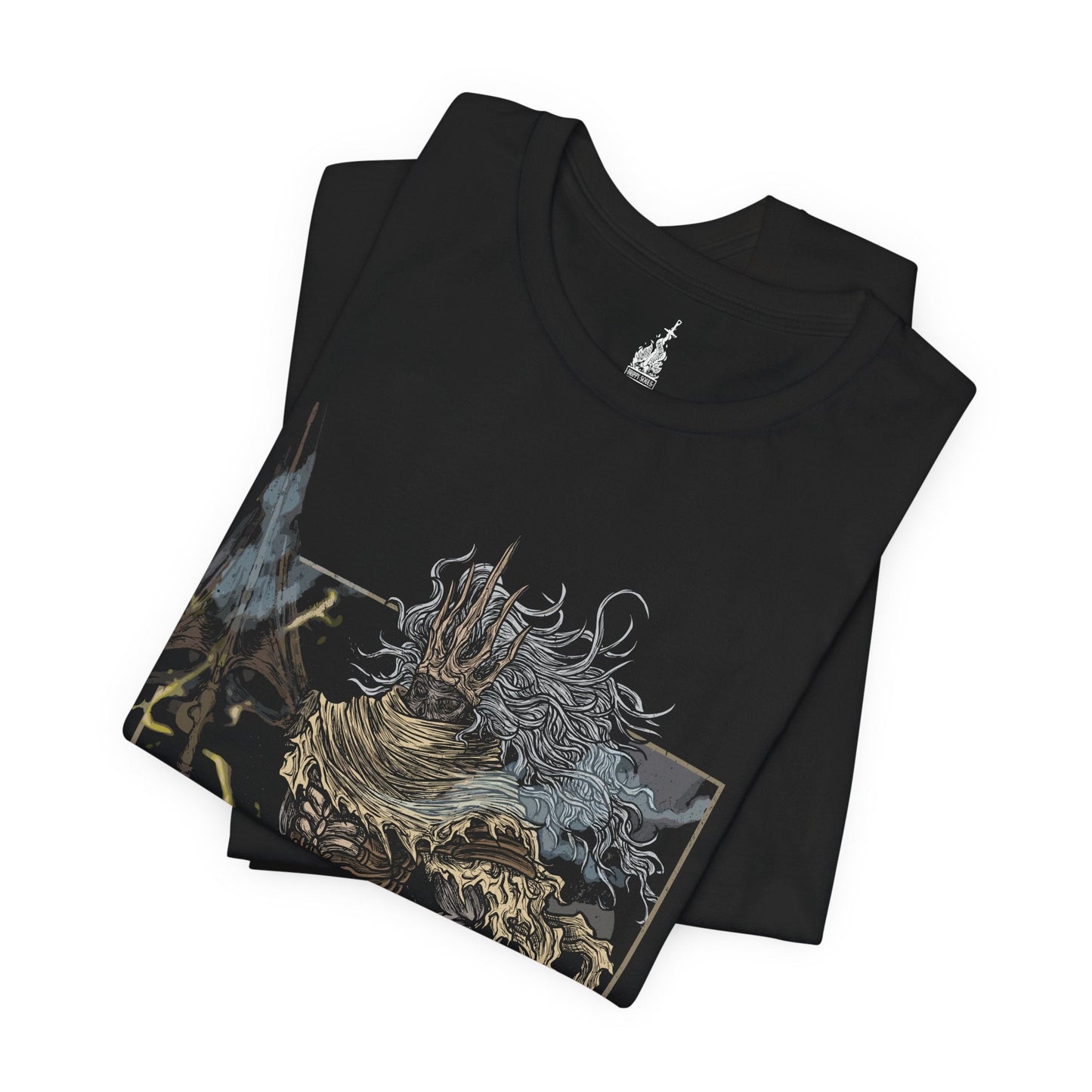 Folded T-shirt featuring the Nameless King from Dark Souls III, the forgotten son of Gwyn and slayer of dragons who forsook his throne to ally with the storm. Mounted atop his Stormdrake, King of the Storm, he commands lightning and wind with divine authority. This design captures the epic scale of his battle, symbolizing betrayal, divine wrath, and the hidden legacy of the gods.