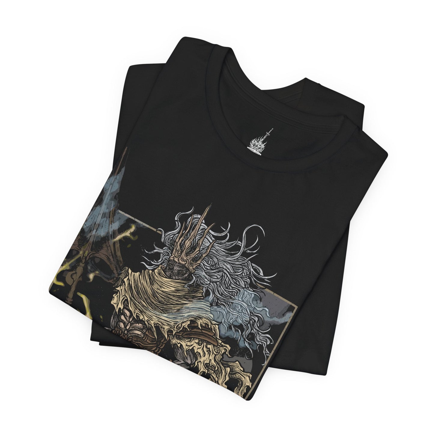 Folded T-shirt featuring the Nameless King from Dark Souls III, the forgotten son of Gwyn and slayer of dragons who forsook his throne to ally with the storm. Mounted atop his Stormdrake, King of the Storm, he commands lightning and wind with divine authority. This design captures the epic scale of his battle, symbolizing betrayal, divine wrath, and the hidden legacy of the gods.