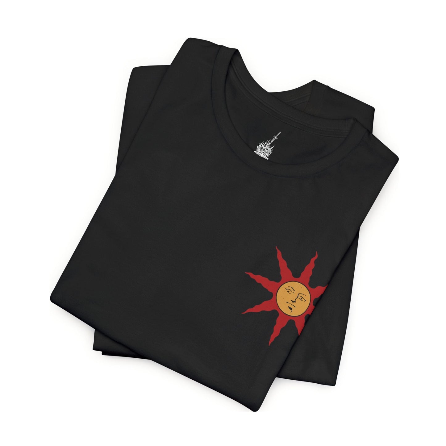 Folded T-shirt featuring Solaire of Astora from Dark Souls, the ever-hopeful knight on a quest to find his own sun. Clad in distinct armor bearing the radiant sun emblem, Solaire stands as a symbol of jolly cooperation in a bleak world. This design captures his iconic pose—arms raised in joyful praise beneath a golden sky.