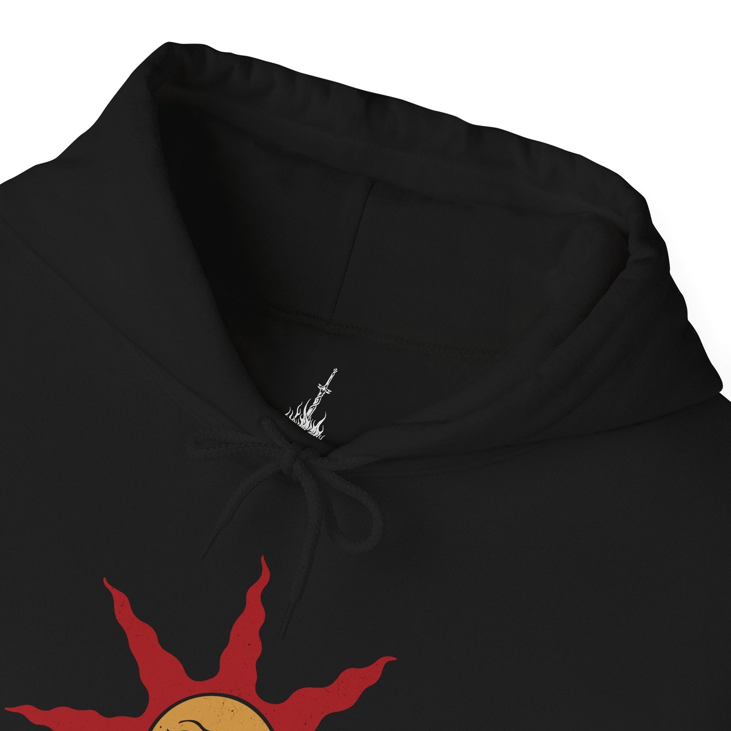 Folded Hooded Sweatshirt showcasing the legendary Solaire of Astora, one of the most beloved characters in Dark Souls. A Warrior of Sunlight and beacon of camaraderie, his glowing sun sigil and knightly armor are instantly recognizable. This artwork pays tribute to his unwavering optimism and the iconic phrase, Praise the Sun!