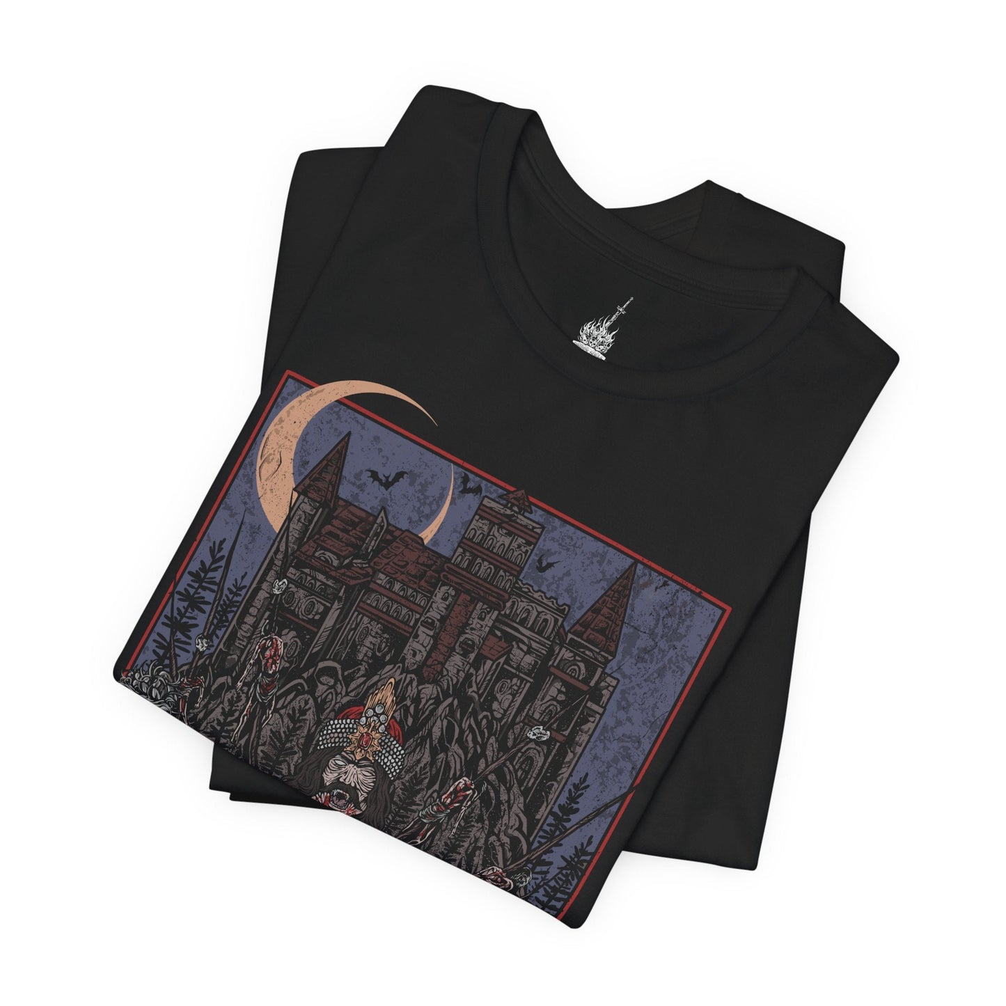 Folded T-shirt showcasing Vlad the Impaler, also known as Vlad Dracula, the fearsome Wallachian prince whose brutal methods made him a figure of horror and myth. Cloaked in medieval armor and set against a backdrop of gothic towers and burning skies, this artwork captures the eerie power of the original vampire legend.