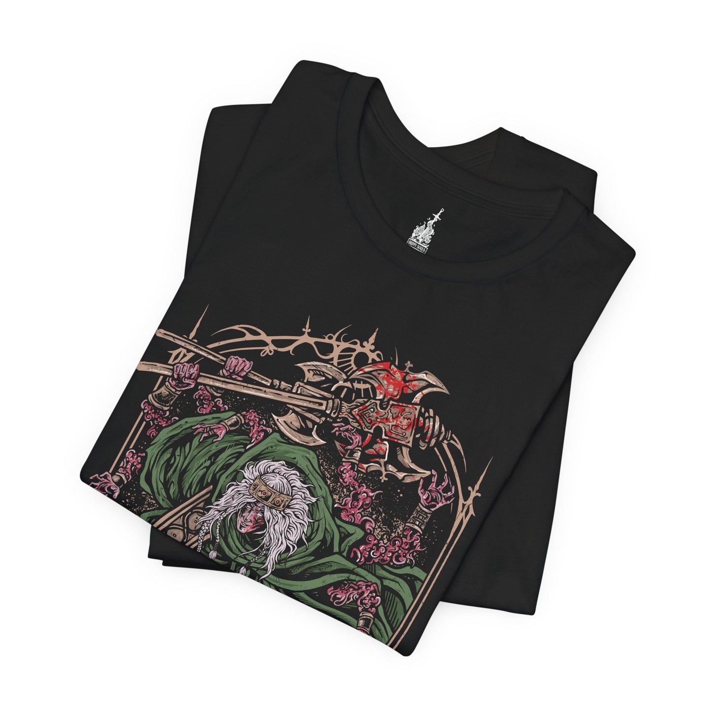 Folded T-shirt featuring Godrick the Grafted from Elden Ring, the grotesque demigod of Stormveil Castle. Known for grafting countless limbs onto his body to fuel his strength, Godrick embodies ambition twisted into monstrosity. This design captures his terrifying form, symbolizing his hunger for power and his legacy as one of the first shardbearers.