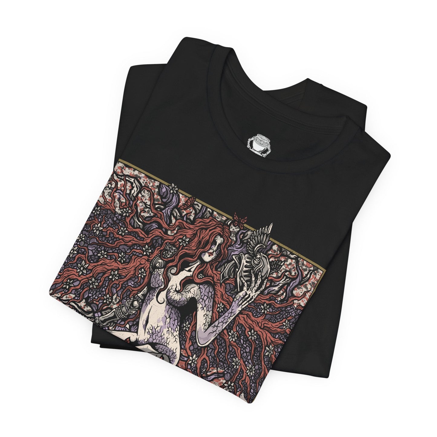 Folded T-shirt featuring Malenia, Goddess of Rot from Elden Ring, the fearsome demigod whose elegance masks a devastating curse. Wielding her prosthetic katana with unmatched precision, Malenia is both graceful and deadly. This design captures her second form, where Scarlet Rot blooms in divine wrath, symbolizing beauty entwined with decay in one of the game’s most iconic battles.