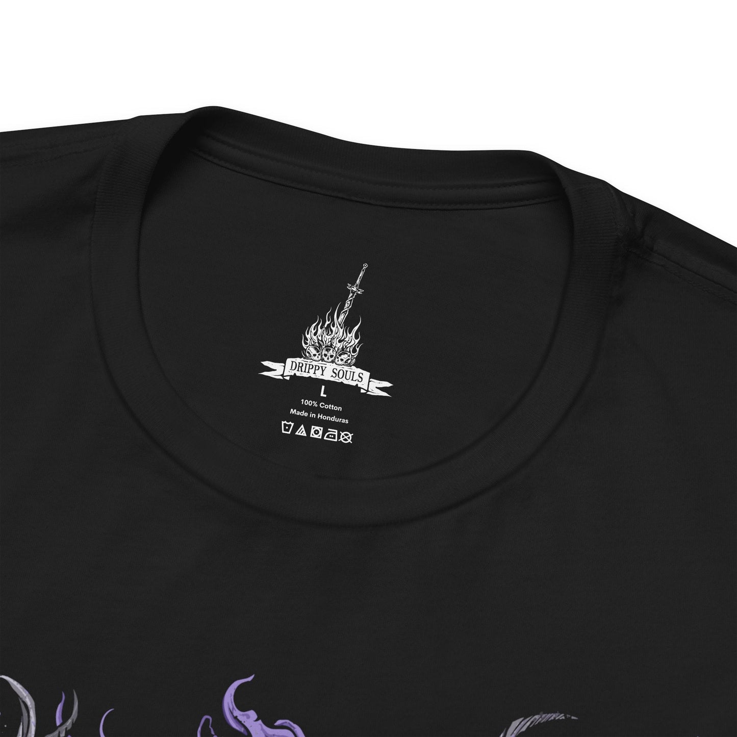 Folded T-shirt featuring Manus, Father of the Abyss from Dark Souls, the primeval man whose humanity was shattered into darkness. A towering, writhing figure of shadow and rage, Manus unleashed the Abyss upon Oolacile in his frenzied search for his lost pendant. This design captures his terrifying form and tragic origin as the source of the Abyss.