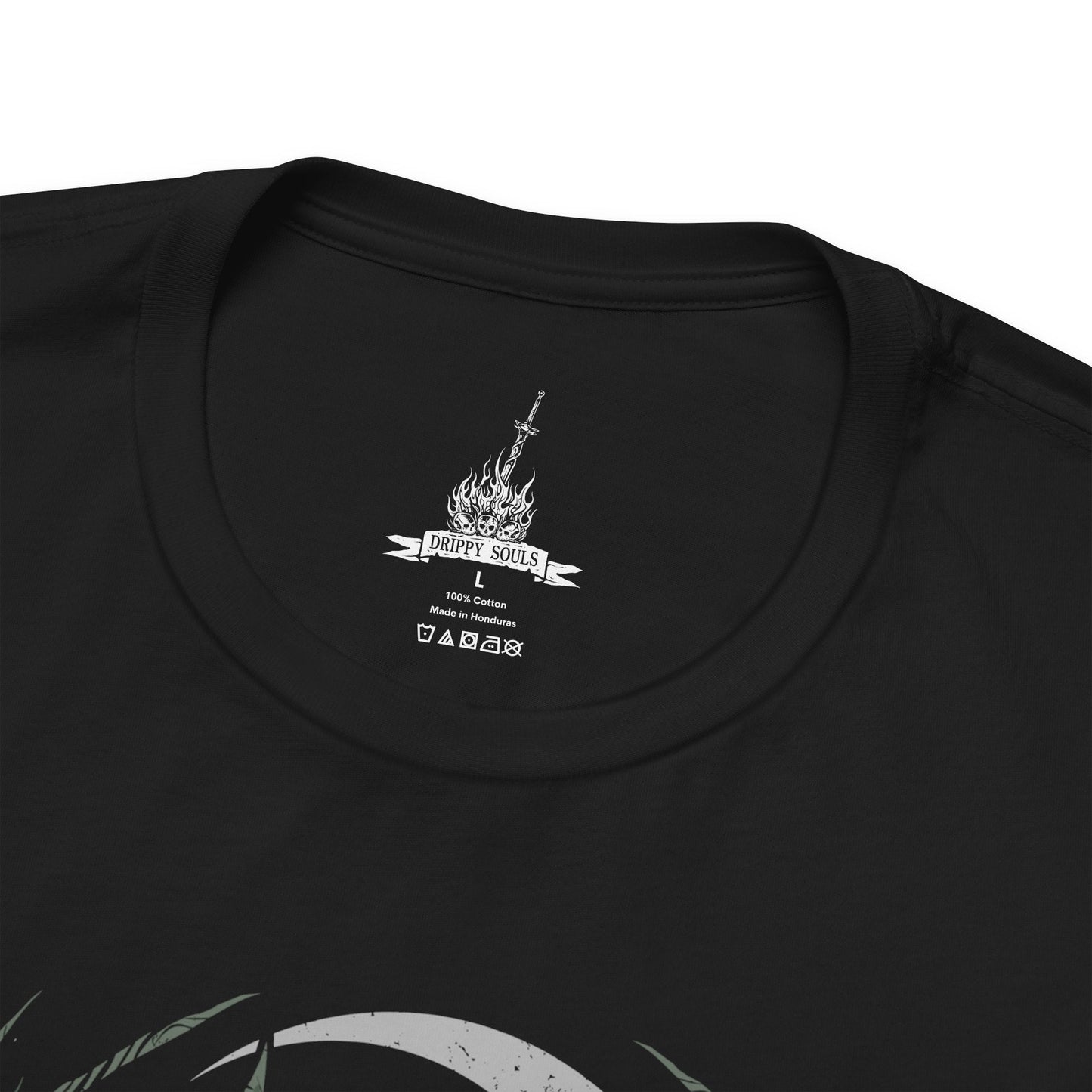 Folded T-Shirt design featuring the Mushroom People of Darkroot Garden from Dark Souls, standing among ancient trees, tangled roots, and thick forest mist. Their oversized mushroom-like bodies emerge from the shadows beneath the canopy while faint sunlight filters through the branches. The design captures the strange, peaceful, and unsettling atmosphere of Darkroot Garden and its mysterious inhabitants.