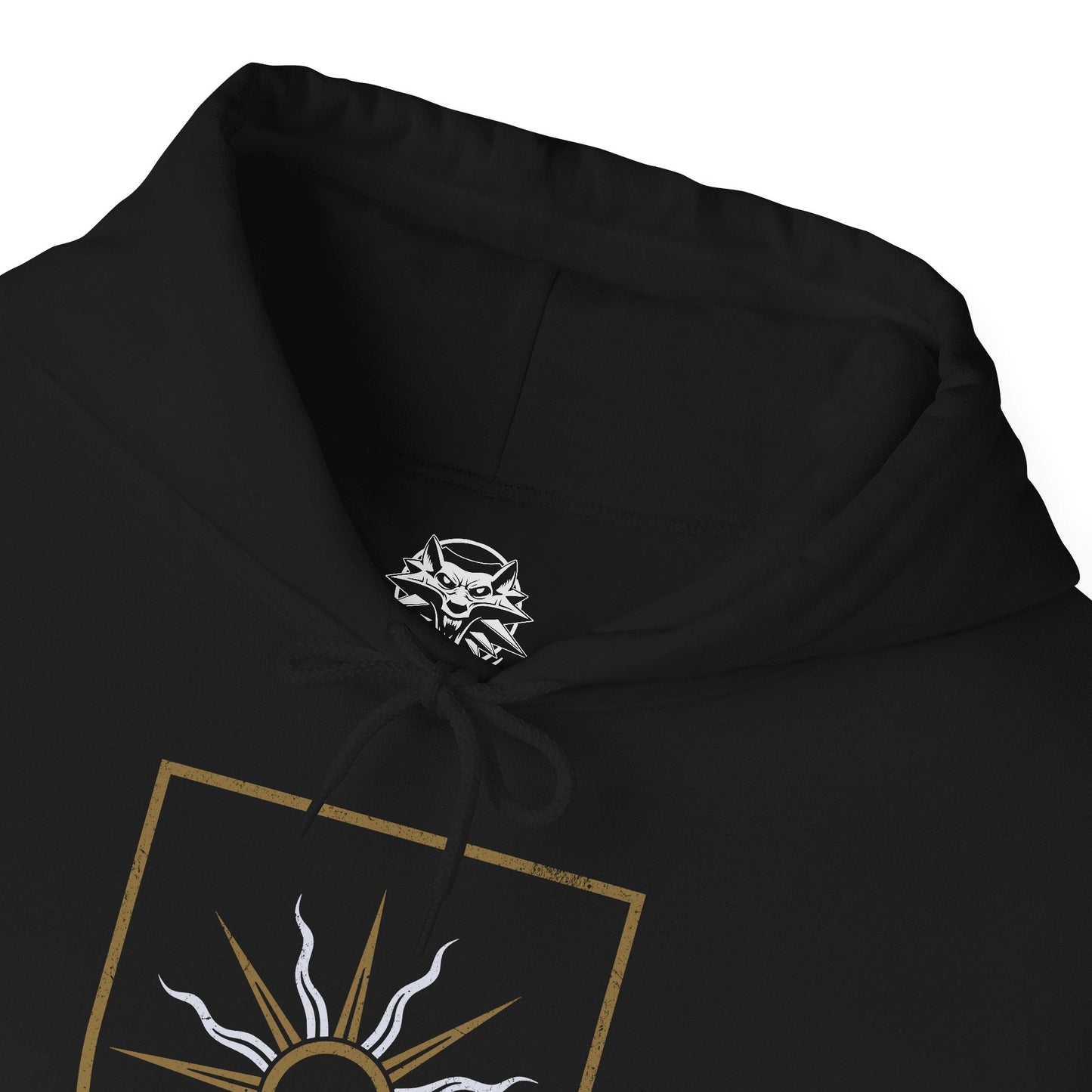 Folded Hooded Sweatshirt of the Beast of White Orchard descending from the clouds, wings beating through smoke and ash as the battlefield below lies silent. Once part of a bonded pair, the griffin’s rage embodies loss and disruption caused by Nilfgaard’s invasion. The design emphasizes tragedy, raw power, and the grim reality that war breeds monsters beyond the battlefield.