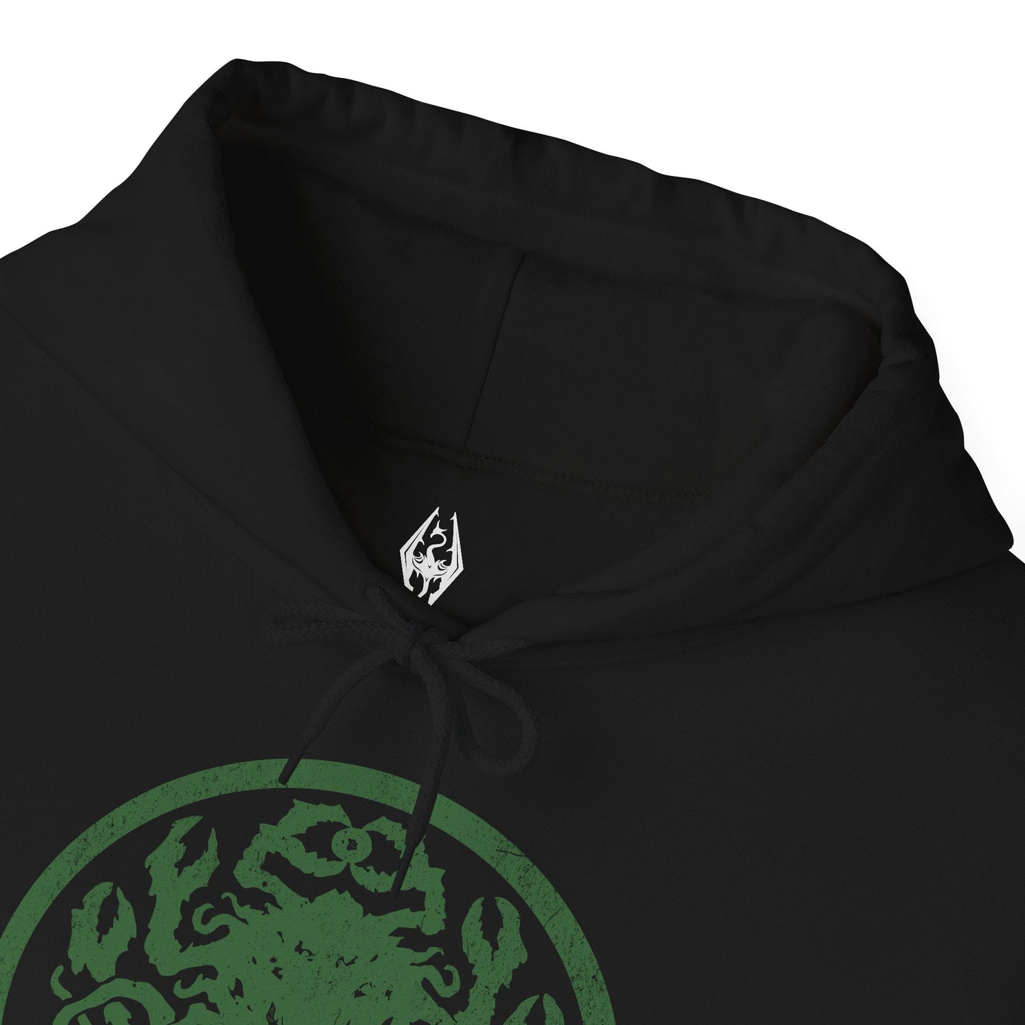 Folded Hooded Sweatshirt inspired by Apocrypha from Skyrim, featuring Hermaeus Mora—the Daedric Prince of forbidden wisdom—and Miraak, the rogue Dragonborn who sought dominion beyond Mundus. Encircled by green void-light and shifting tomes, this design captures the eerie silence of Apocrypha, where knowledge is power, secrets demand a price, and escape is never guaranteed.