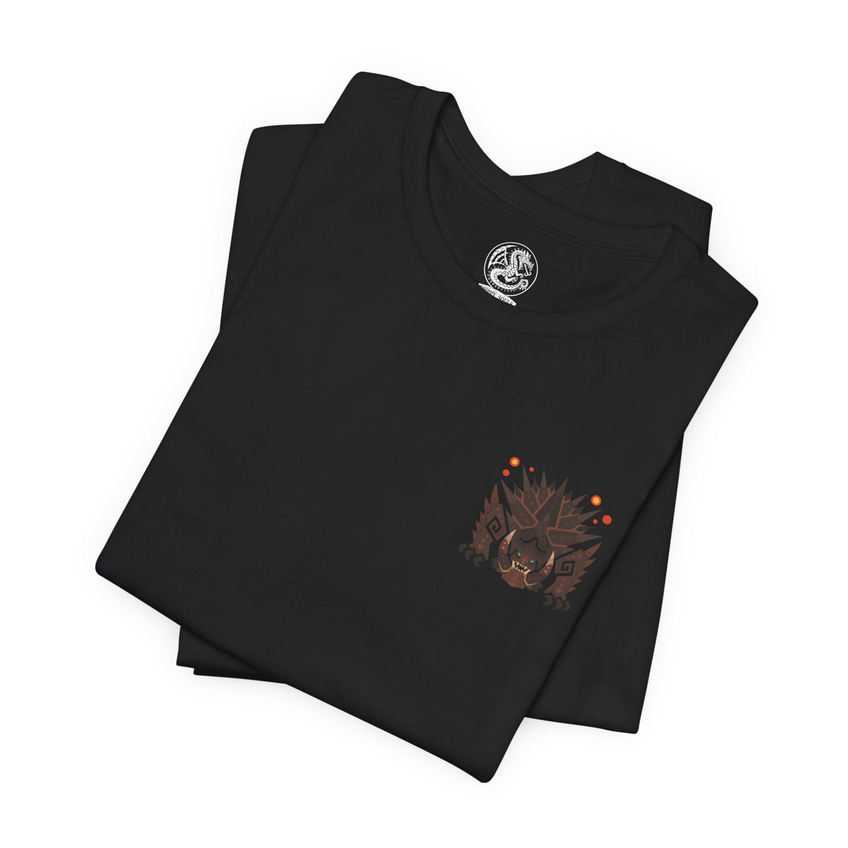Image 6 of a T-Shirt artwork depicting Akantor roaring from the depths of a volcanic crater, its gigantic tusks and armored body illuminated by rivers of molten lava. Jagged mountains and clouds of volcanic ash surround the beast as the ground cracks beneath its immense weight. This design reflects the monster's destructive strength, ferocious temperament, and terrifying presence as one of Monster Hunter's most formidable elder-level threats.