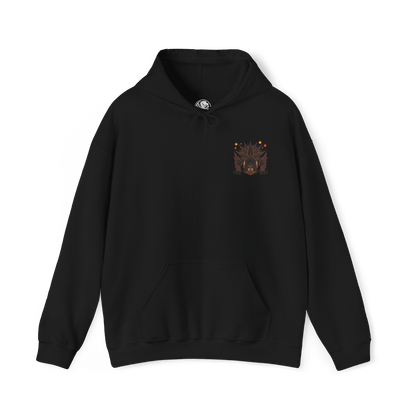 Image 4 of a Hooded Sweatshirt of Akantor charging across a shattered volcanic landscape, its massive jaws open in a devastating roar as fire and debris erupt around its body. Dark smoke fills the horizon while crimson energy glows across its eyes and mouth. The composition emphasizes primal brutality, immense scale, and the unstoppable force of a monster capable of reshaping the battlefield through sheer physical power.
