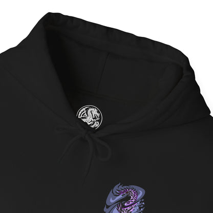 Folded Hooded Sweatshirt of Alatreon soaring above a ruined battlefield, its obsidian scales glowing as multiple elemental forces collide around its wings. Firestorms, ice crystals, lightning bolts, and dragon energy spiral together beneath a darkened sky while the earth crumbles below. The composition emphasizes divine destruction, elemental supremacy, and the apocalyptic presence of one of Monster Hunter's most iconic and feared Black Dragons.