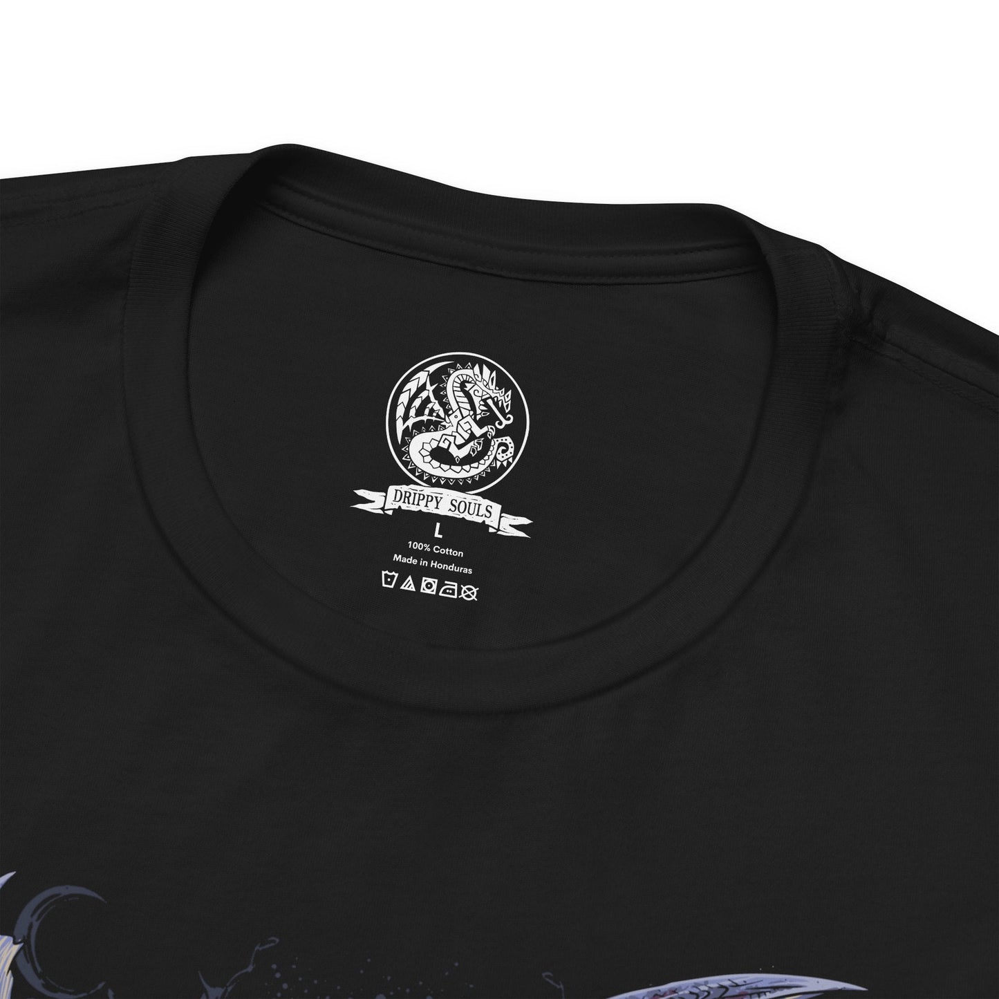 Folded T-Shirt design of Alatreon from Monster Hunter, the Blazing Black Dragon descending through a storm as fire, ice, thunder, dragon, and water elements erupt around its colossal body. Massive black horns and razor-sharp wings dominate the battlefield while the sky fractures beneath its elemental wrath. The design captures Alatreon's mastery over every element, embodying catastrophic power and the fear inspired by one of Monster Hunter's most legendary Black Dragons.