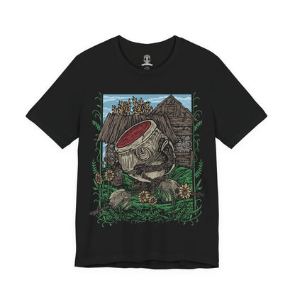 Image 4 of a T-Shirt design of Iron Fist Alexander, the Warrior Jar from Elden Ring, standing proudly among the peaceful flower-filled village of Jarburg. His enormous clay body is decorated with cracks and battle scars as sunlight illuminates the jars and stone paths around him. The design captures Alexander's adventurous spirit, unwavering courage, and dream of becoming a mighty warrior worthy of legendary battles.