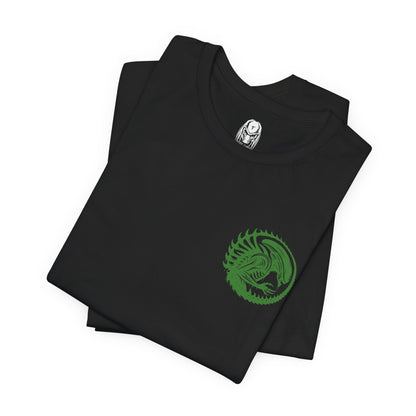 Image 6 of a T-Shirt artwork depicting a Xenomorph stalking through a dark spaceship corridor, steam rising from vents as its skeletal body blends into the environment. Its tail coils behind it while dim red lights flicker across metallic walls. This design reflects survival horror at its peak, emphasizing stealth, fear, and the relentless nature of one of cinema’s most iconic monsters.