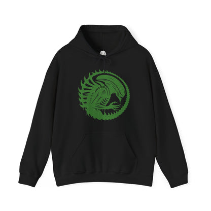 Image 4 of a Hooded Sweatshirt of a Xenomorph standing over its prey in a dimly lit chamber, its glossy exoskeleton reflecting harsh industrial lighting. Shadows stretch across the floor as its elongated skull tilts forward, ready to attack. The composition emphasizes isolation, terror, and the unstoppable instinct of a creature designed purely for survival and dominance.