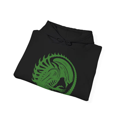 Image 6 of a Hooded Sweatshirt of a Xenomorph standing over its prey in a dimly lit chamber, its glossy exoskeleton reflecting harsh industrial lighting. Shadows stretch across the floor as its elongated skull tilts forward, ready to attack. The composition emphasizes isolation, terror, and the unstoppable instinct of a creature designed purely for survival and dominance.