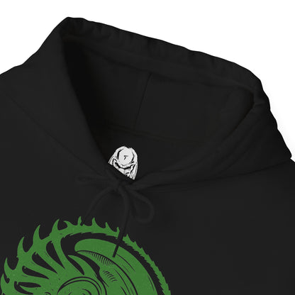 Folded Hooded Sweatshirt of a Xenomorph standing over its prey in a dimly lit chamber, its glossy exoskeleton reflecting harsh industrial lighting. Shadows stretch across the floor as its elongated skull tilts forward, ready to attack. The composition emphasizes isolation, terror, and the unstoppable instinct of a creature designed purely for survival and dominance.