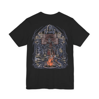 Image 5 of a T-Shirt artwork depicting the Fire Keeper gently guiding the Ashen One beneath the fading light of Firelink Shrine, surrounded by ancient thrones, flickering bonfires, and scattered ash. Warm ember light illuminates the shrine while darkness gathers beyond its walls. This design reflects destiny, sacrifice, and the quiet companionship shared throughout the Ashen One's journey to determine the fate of the Age of Fire.