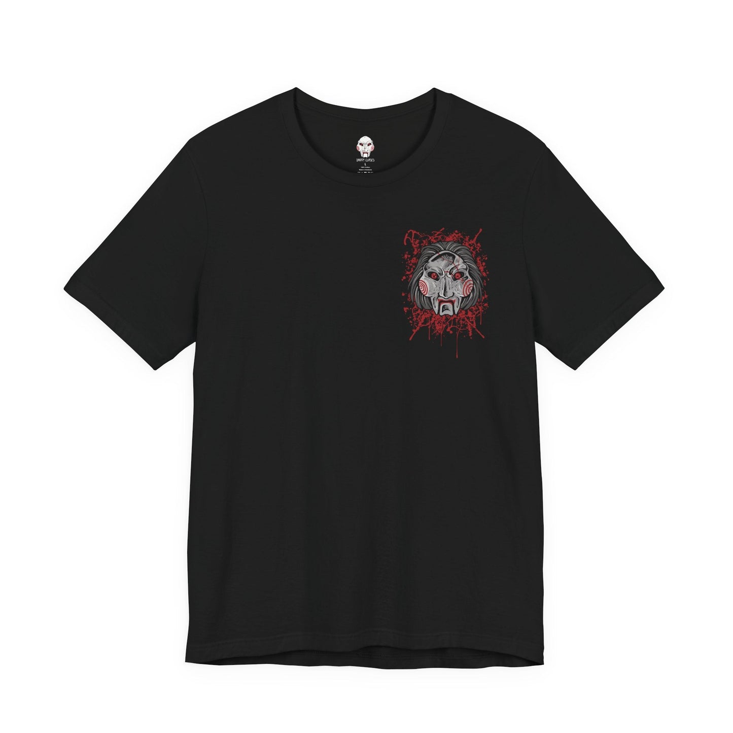 Image 4 of a T-Shirt artwork depicting Billy the Puppet emerging from darkness with his tricycle positioned beneath a harsh spotlight. Shadows stretch across the floor while old television screens and mechanical traps fill the background. This design reflects the disturbing symbolism of Jigsaw’s messenger, embodying dread, manipulation, and the cruel tests that define the Saw franchise.