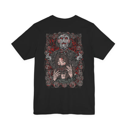Image 5 of a T-Shirt artwork depicting Billy the Puppet emerging from darkness with his tricycle positioned beneath a harsh spotlight. Shadows stretch across the floor while old television screens and mechanical traps fill the background. This design reflects the disturbing symbolism of Jigsaw’s messenger, embodying dread, manipulation, and the cruel tests that define the Saw franchise.