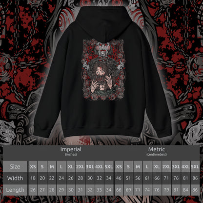 Size chart of a Hooded Sweatshirt of Billy the Puppet staring forward with a sinister grin, his black suit and red bow tie framed by chains, gears, and rusted metal. A dim industrial setting fades behind him as ominous red light highlights his face. The composition emphasizes psychological tension, horror, and the iconic image of the puppet who announces Jigsaw’s deadly games.