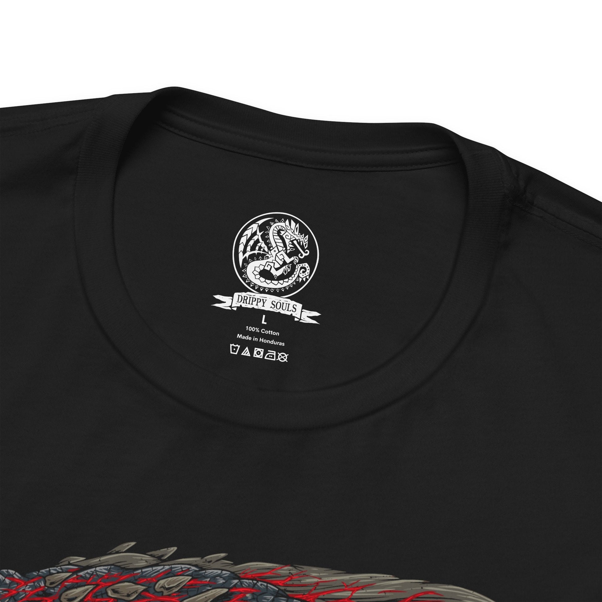 Folded T-Shirt design of Bloodbath Diablos from Monster Hunter, charging across a scarred desert with its massive black horns stained crimson and steam erupting from deep battle wounds. Sand explodes beneath its immense strength as dust storms engulf the battlefield. The design captures the relentless fury of the Deviant, forged through countless battles into a living force of vengeance and destruction.