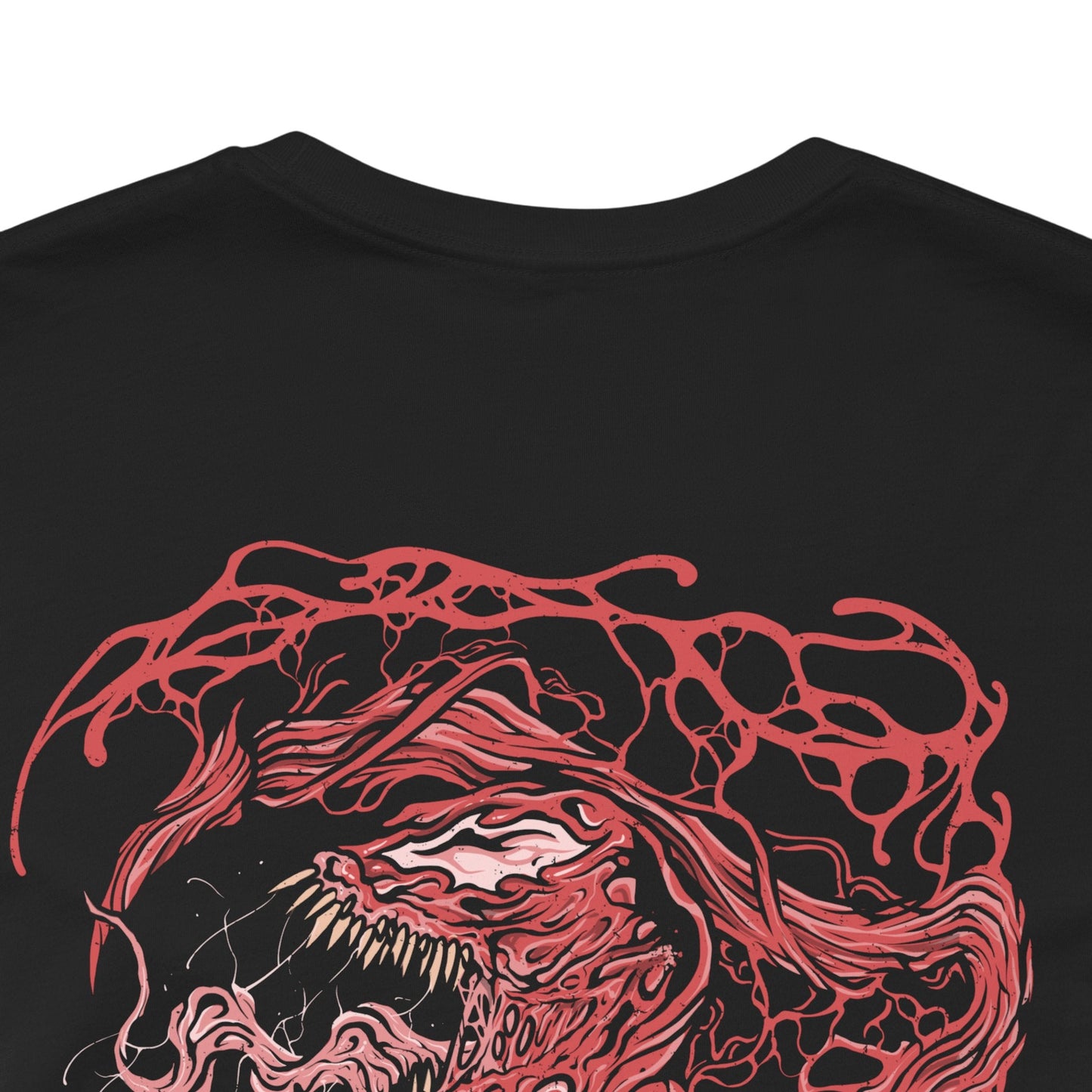 Image 7 of a T-Shirt artwork depicting Carnage lunging forward through a storm of blood-red symbiote tendrils, claws extended as the ground fractures beneath him. Black and crimson textures ripple across his body while sharp appendages form from living organic matter. This design reflects uncontrollable brutality, psychotic energy, and the savage nature of one of Marvel’s most dangerous symbiotes.