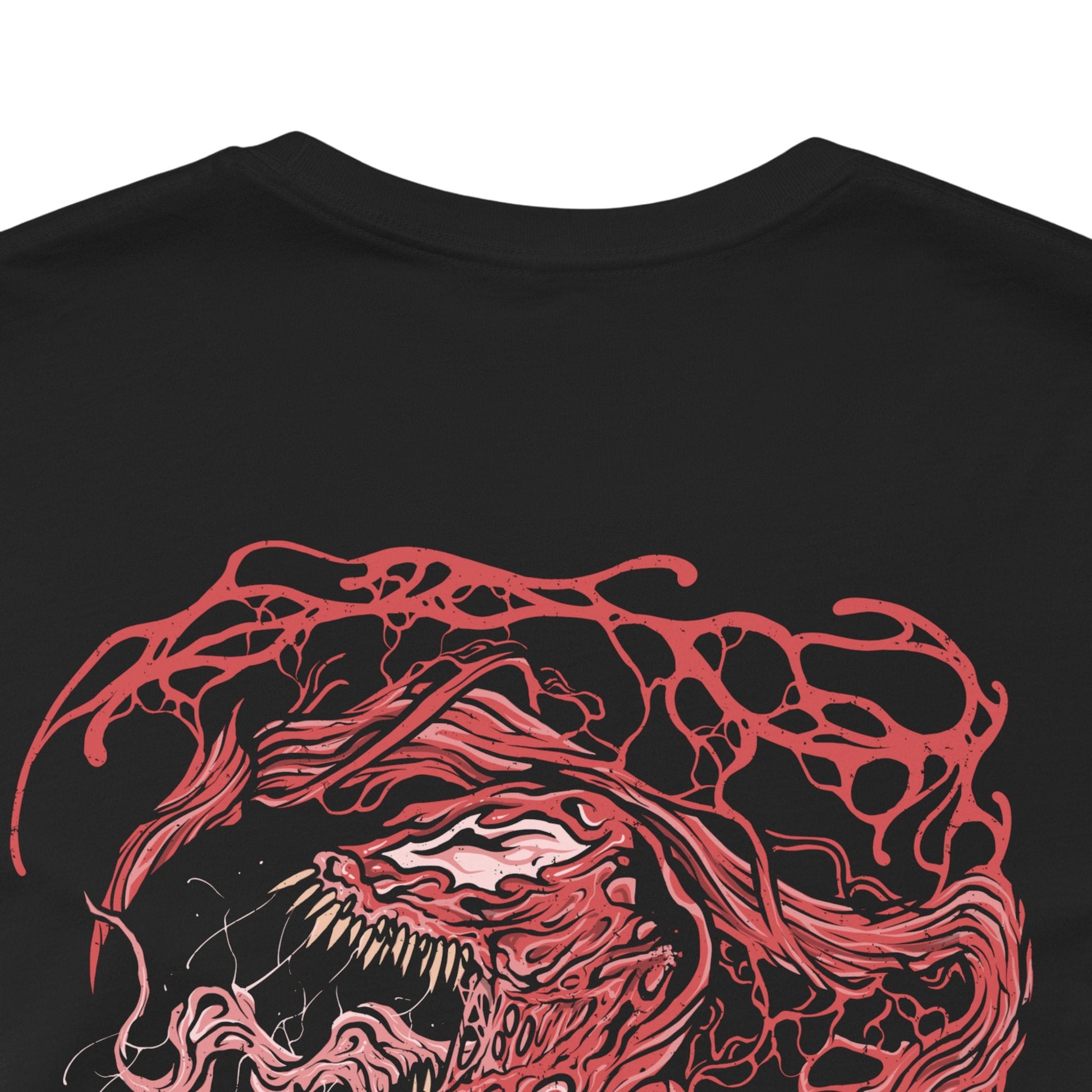 Image 7 of a T-Shirt artwork depicting Carnage lunging forward through a storm of blood-red symbiote tendrils, claws extended as the ground fractures beneath him. Black and crimson textures ripple across his body while sharp appendages form from living organic matter. This design reflects uncontrollable brutality, psychotic energy, and the savage nature of one of Marvel’s most dangerous symbiotes.