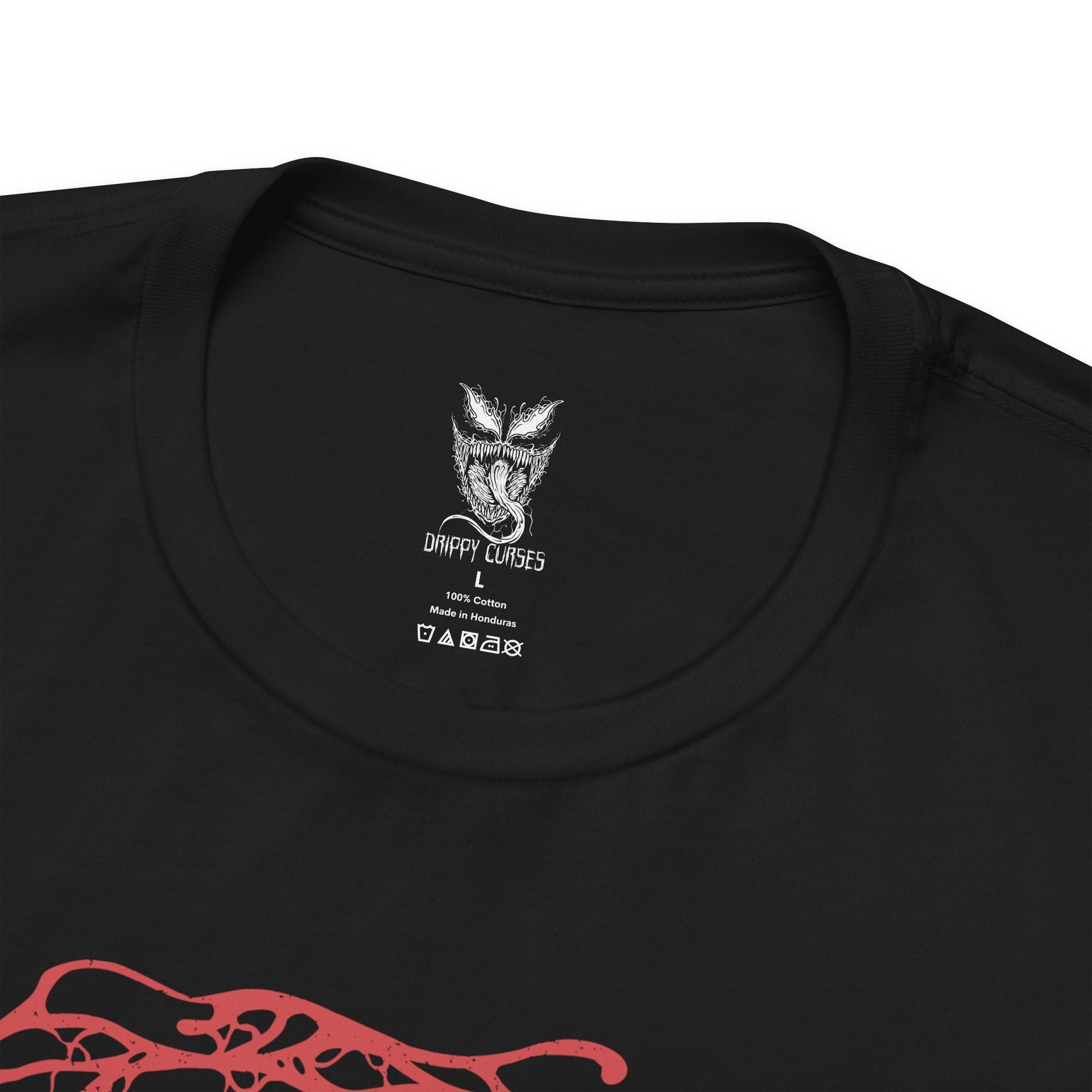 Folded T-Shirt design of Carnage from Marvel, the crimson symbiote erupting into jagged tendrils and razor-sharp blades as chaos unfolds around him. His glowing white eyes and monstrous grin cut through the darkness while living red biomass twists across his muscular frame. The design captures pure madness, unchecked violence, and the terrifying bond between the Carnage symbiote and its host.