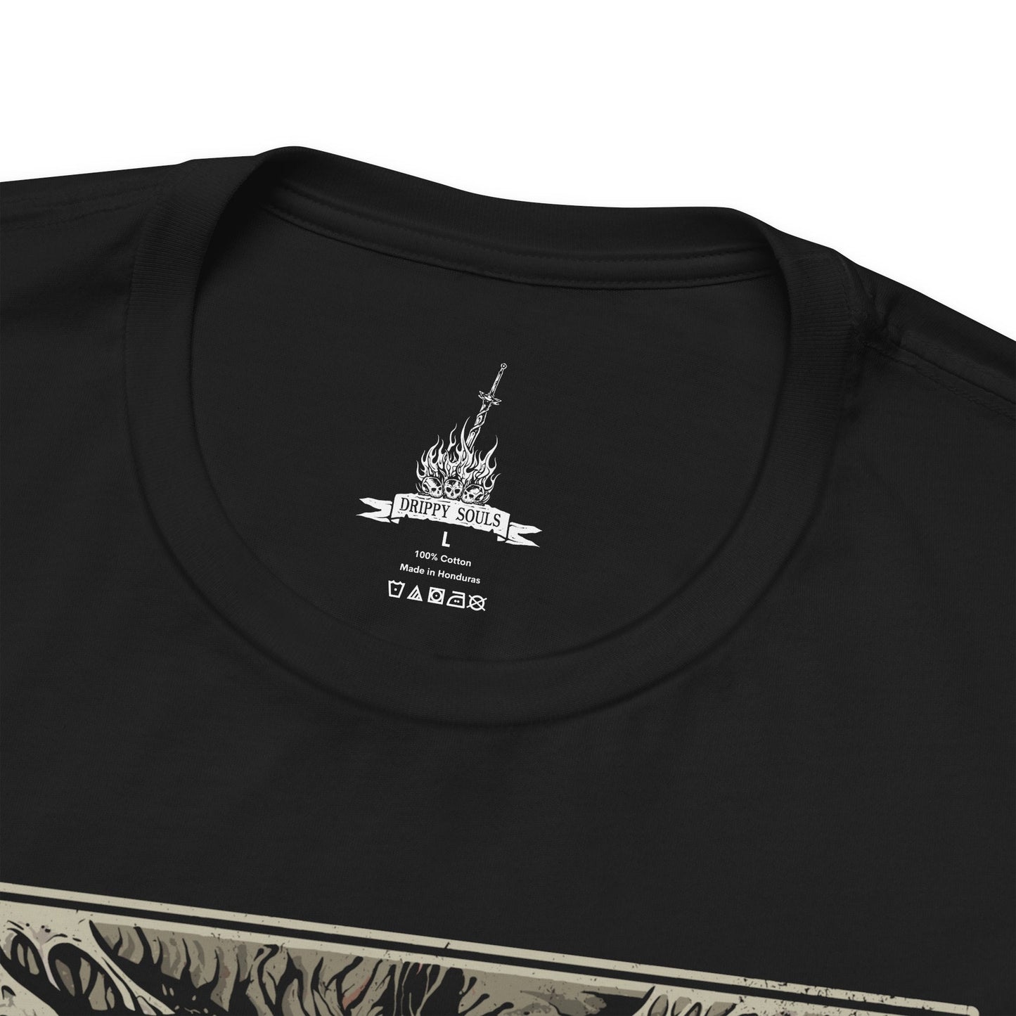 Folded T-shirt featuring Chaos Witch Quelaag from Dark Souls, the fearsome half-woman, half-spider guardian of Blighttown. Twisted by the Chaos Flame, she protects her sister while luring unwary Undead into her lair of fire and poison. This design captures her haunting fusion of beauty and monstrosity, a symbol of sacrifice and corruption.