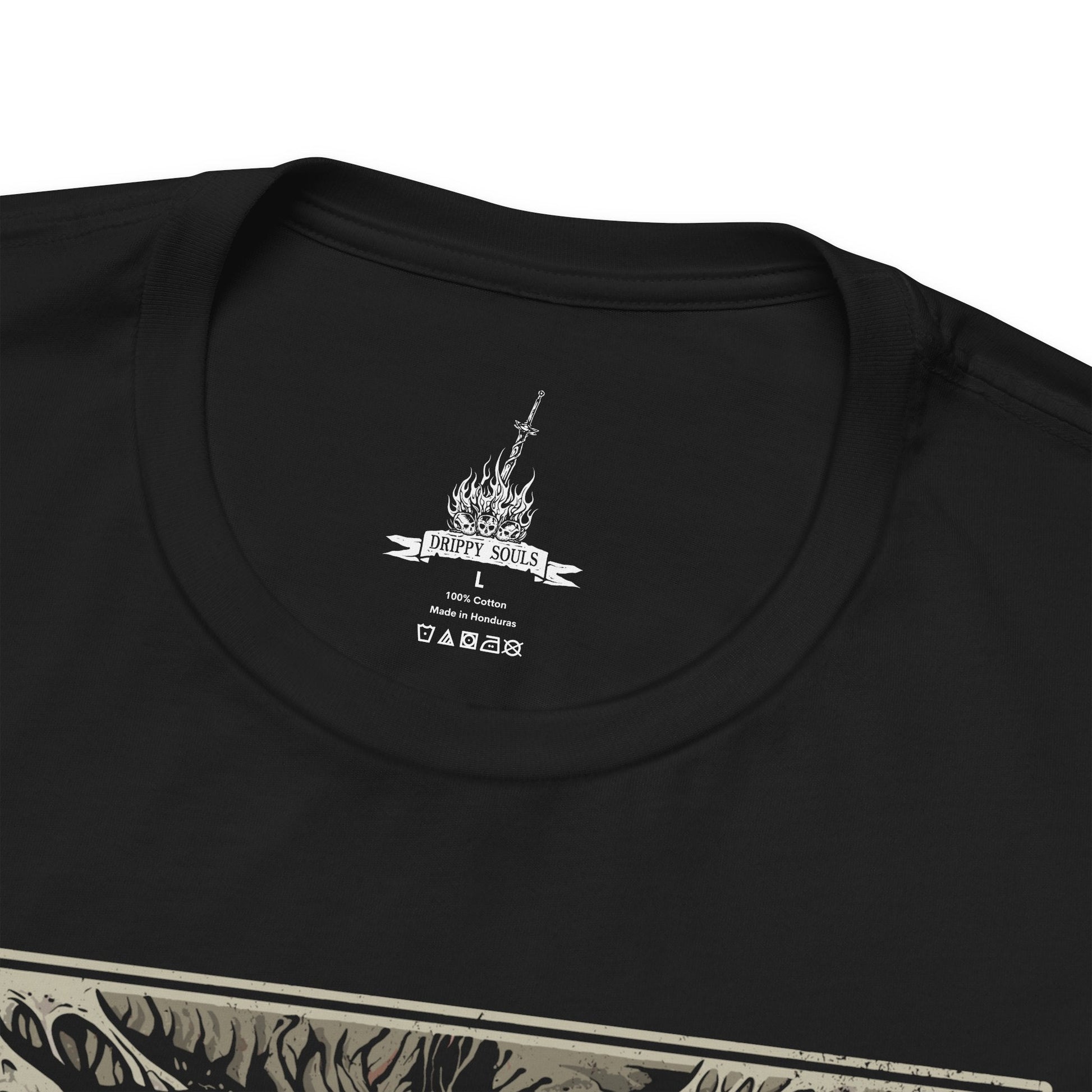 Folded T-shirt featuring Chaos Witch Quelaag from Dark Souls, the fearsome half-woman, half-spider guardian of Blighttown. Twisted by the Chaos Flame, she protects her sister while luring unwary Undead into her lair of fire and poison. This design captures her haunting fusion of beauty and monstrosity, a symbol of sacrifice and corruption.