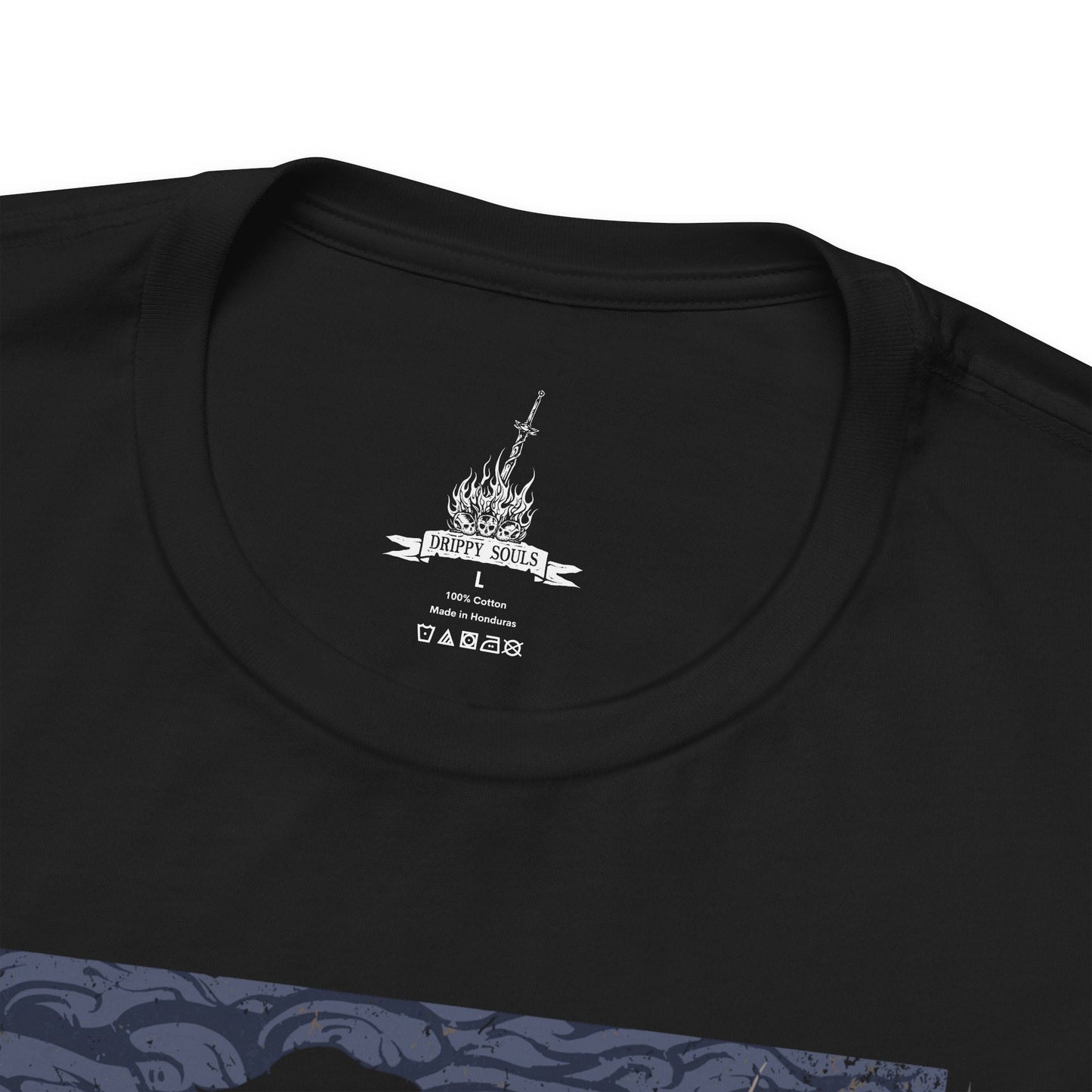 Folded T-shirt featuring the Chosen Undead at Firelink Shrine from Dark Souls, the weary hero resting at the hub of Lordran’s journey. Surrounded by crumbling ruins, the bonfire burns as a fragile beacon of hope in a dying world. This design captures the solitude, determination, and quiet reflection of the Undead’s cursed pilgrimage.