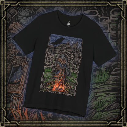 Thumbnail of a T-shirt featuring the Chosen Undead at Firelink Shrine from Dark Souls, the weary hero resting at the hub of Lordran’s journey. Surrounded by crumbling ruins, the bonfire burns as a fragile beacon of hope in a dying world. This design captures the solitude, determination, and quiet reflection of the Undead’s cursed pilgrimage.
