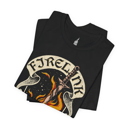 Folded T-shirt featuring the Firelink Shrine Bonfire from Dark Souls in a vintage design, capturing the iconic resting place of the Chosen Undead, perfect for fans who cherish the game's rich atmosphere and the comforting warmth of the bonfire.