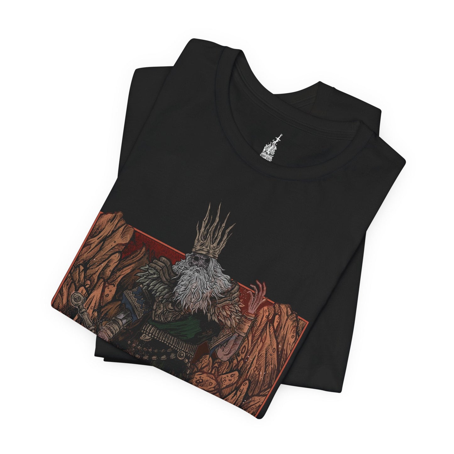 Folded T-shirt featuring Gwyn, Lord of Cinder from Dark Souls in a grim design, capturing his fiery, decayed form and tragic fall from grace, ideal for fans who revere the tragic, fallen king and his role in the age of fire.