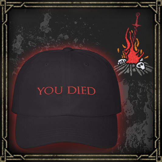 Thumbnail of a Embroidered Cap featuring the iconic “You Died” screen from Dark Souls, a legendary meme recognized by gamers worldwide. Displayed in bold red text over a black backdrop, this phrase symbolizes brutal difficulty, hard-earned lessons, and countless player deaths. A perfect design for fans who wear their defeats with pride and humor.