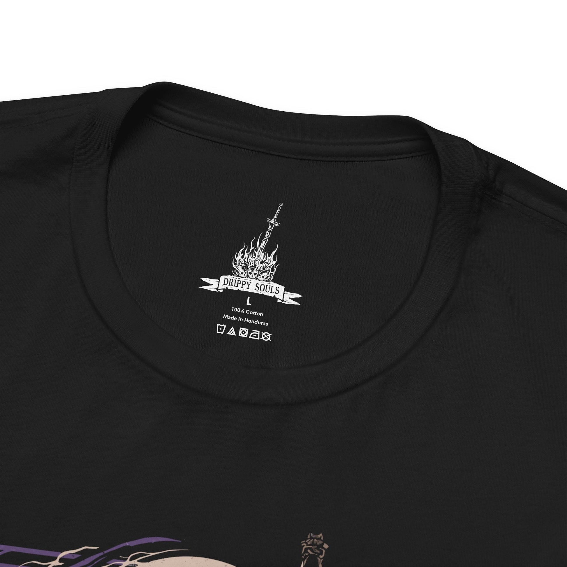Folded T-shirt featuring Darkeater Midir from Dark Souls III, the massive abyssal dragon tasked by the gods to consume the darkness. Once a loyal guardian, Midir now succumbs to the very corruption he was meant to destroy. This design captures his shadowy scales, glowing eyes, and the tragic majesty of his eternal battle against the Abyss.
