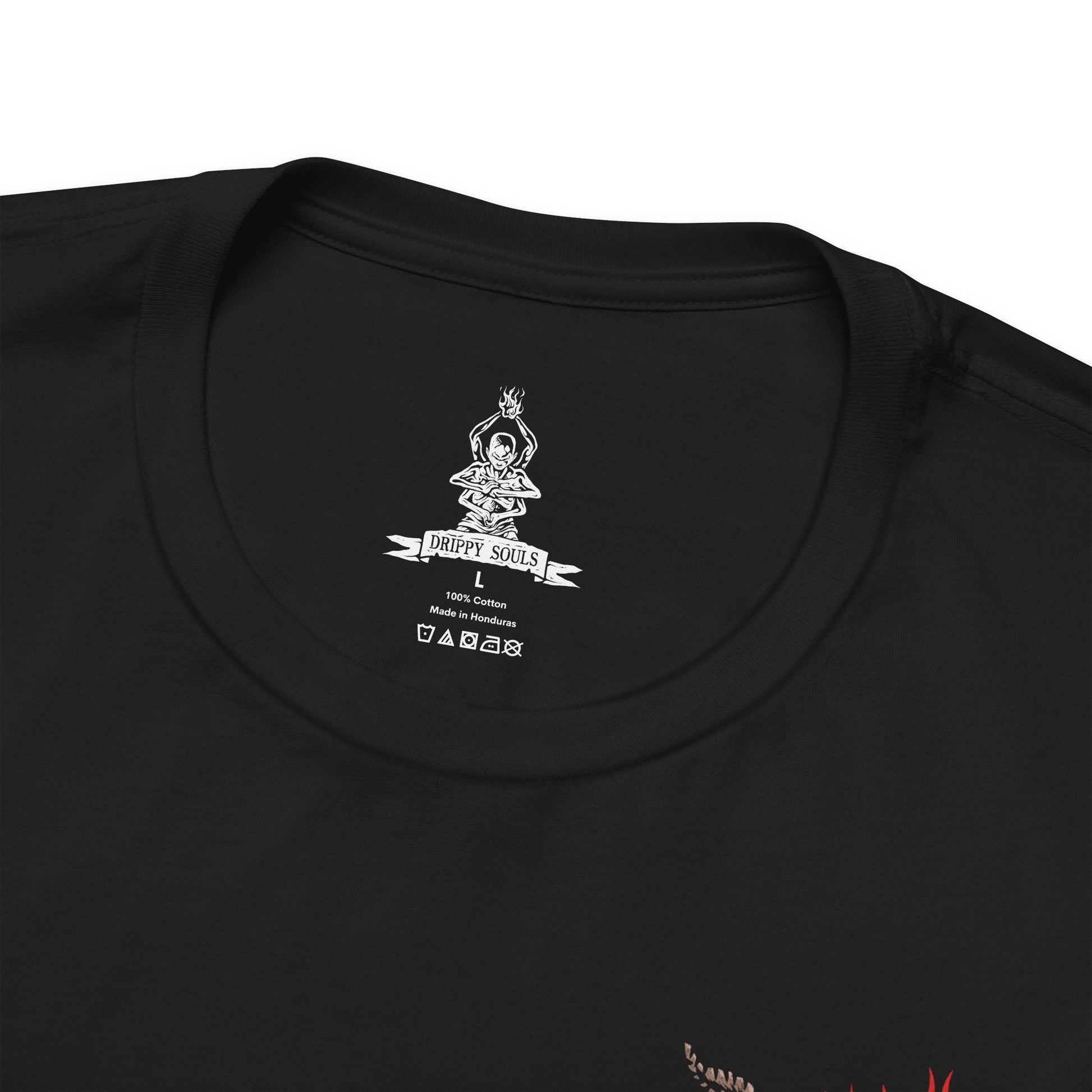Folded T-shirt artwork depicting the Sculptor’s final transformation into the Demon of Hatred, his body engulfed in hellish fire as hatred manifests into monstrous form. Ash and sparks swirl through ruined battlefields while Buddha statues crumble nearby. This design reflects the inner torment of a warrior who failed to escape bloodshed, showing how unresolved rage births something far worse than death.