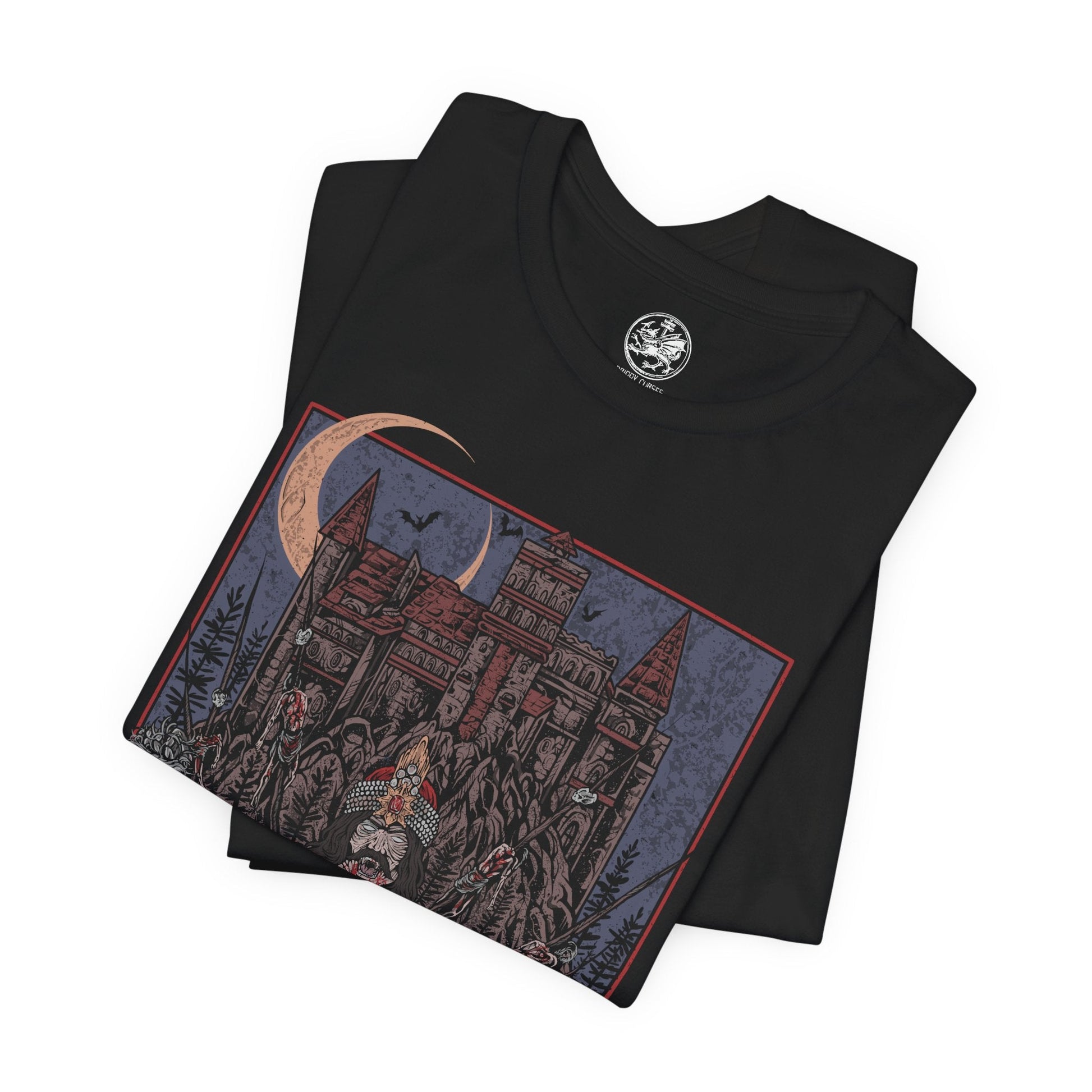 Image 5 of a T-shirt showcasing Vlad the Impaler, also known as Vlad Dracula, the fearsome Wallachian prince whose brutal methods made him a figure of horror and myth. Cloaked in medieval armor and set against a backdrop of gothic towers and burning skies, this artwork captures the eerie power of the original vampire legend.