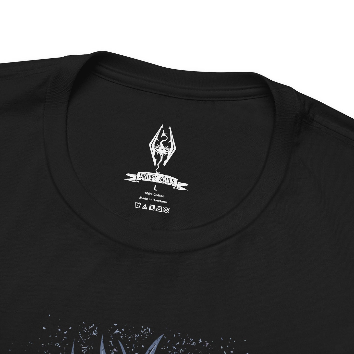 Folded T-shirt featuring the Dovahkiin from The Elder Scrolls V: Skyrim, the legendary Dragonborn hero blessed with the power of the Thu’um. Wielding the voice of dragons and the strength of destiny, the Dovahkiin stands as the last hope against Alduin the World-Eater. This design captures their iconic horned helm and fierce stance beneath the frozen skies of Tamriel.