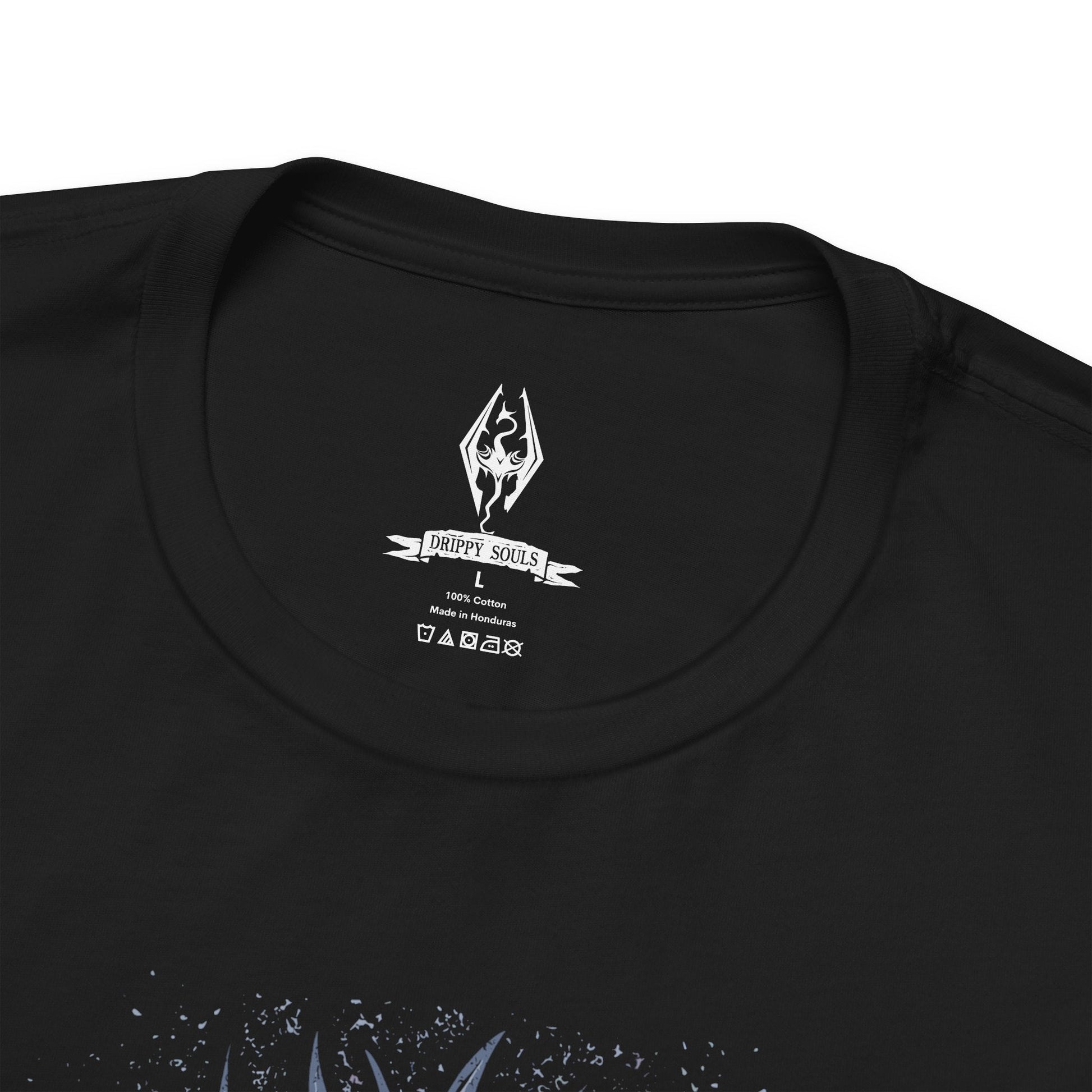 Folded T-shirt featuring the Dovahkiin from The Elder Scrolls V: Skyrim, the legendary Dragonborn hero blessed with the power of the Thu’um. Wielding the voice of dragons and the strength of destiny, the Dovahkiin stands as the last hope against Alduin the World-Eater. This design captures their iconic horned helm and fierce stance beneath the frozen skies of Tamriel.