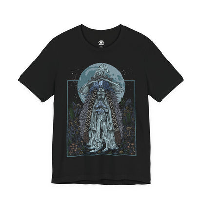 Image 4 of a T-shirt featuring Ranni the Witch from Elden Ring, the mysterious Lunar Princess and Empyrean who defied the Greater Will. Draped in a flowing blue cloak and crowned with her wide-brimmed witch’s hat, Ranni embodies quiet rebellion and arcane mystery. With her ethereal doll form and ties to the stars, she offers one of the game’s most profound and emotional questlines, symbolizing fate, sacrifice, and cosmic ambition.