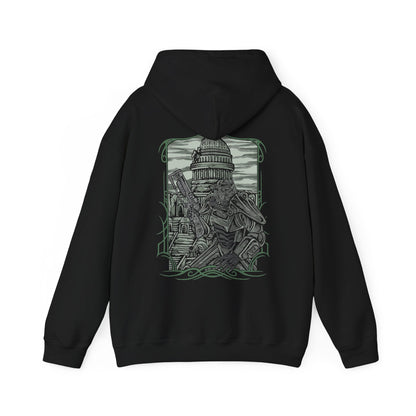 Image 5 of a Hooded Sweatshirt of a Brotherhood of Steel Paladin standing before the Citadel in full T-45d Power Armor, framed by rusted wreckage and the scorched remains of Washington, D.C. The Brotherhood banner flies proudly as green wasteland skies stretch across the horizon. The composition emphasizes resilience, military discipline, and the enduring legacy of one of Fallout 3’s most iconic factions.