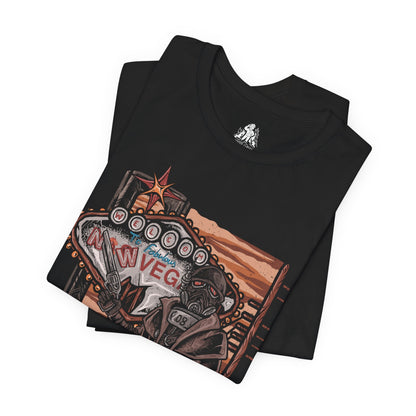 Image 5 of a T-Shirt design of an NCR Ranger from Fallout: New Vegas, standing beneath the blazing Mojave sun in iconic black Ranger combat armor and gas mask. A weathered duster flows through the desert wind as the ranger carries a powerful anti-materiel rifle across the wasteland. The design captures the resilience, discipline, and legendary reputation of the New California Republic's elite lawmen.