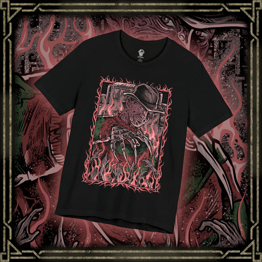 Thumbnail of a T-Shirt design of Freddy Krueger from A Nightmare on Elm Street, emerging from a nightmare-filled darkness with his bladed glove extended toward the viewer. His burned face twists into a sinister grin beneath a worn fedora while red and green stripes fade into shadow behind him. The design captures dreamlike terror, psychological horror, and the unstoppable fear haunting Elm Street.