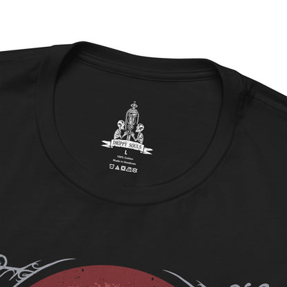 Folded T-shirt design of Gehrman, the First Hunter from Bloodborne, standing within the Hunter’s Dream as pale flowers sway beneath a moonlit sky. His scythe-like Burial Blade gleams with old blood, while the Great Tree and workshop loom behind him. The design captures his tragic role as mentor and prisoner of the Moon Presence, bound eternally to guide hunters through endless nights of slaughter.